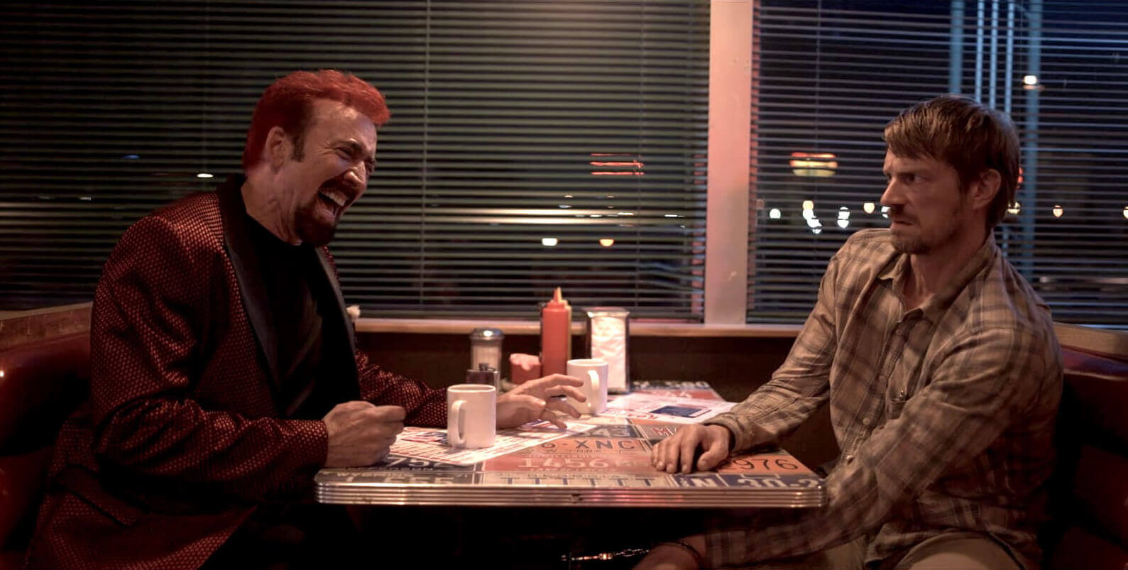 Nicolas Cage and Joel Kinnaman in Sympathy for the Devil (2023).