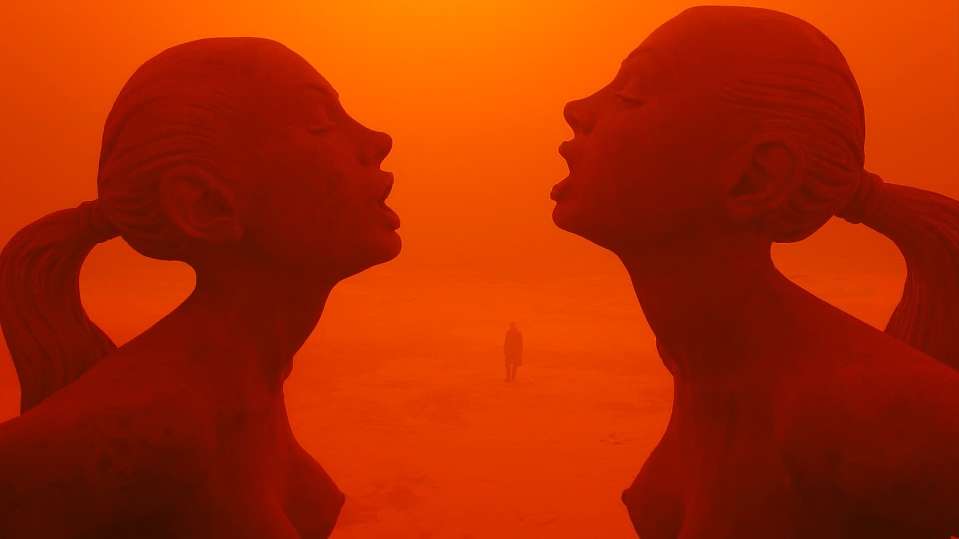 Still from Blade Runner 2049 - Red dust with two woman statue