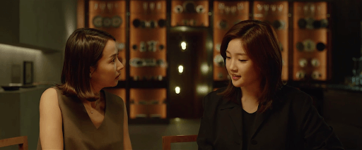 The mother of the Park family (Yeo-jeong Jo) (left) being manipulated by the daughter of the Kim family (So-dam Park) (right).